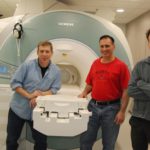 Greg Berns, Mark Spivak, and Peter Cook by the MRI