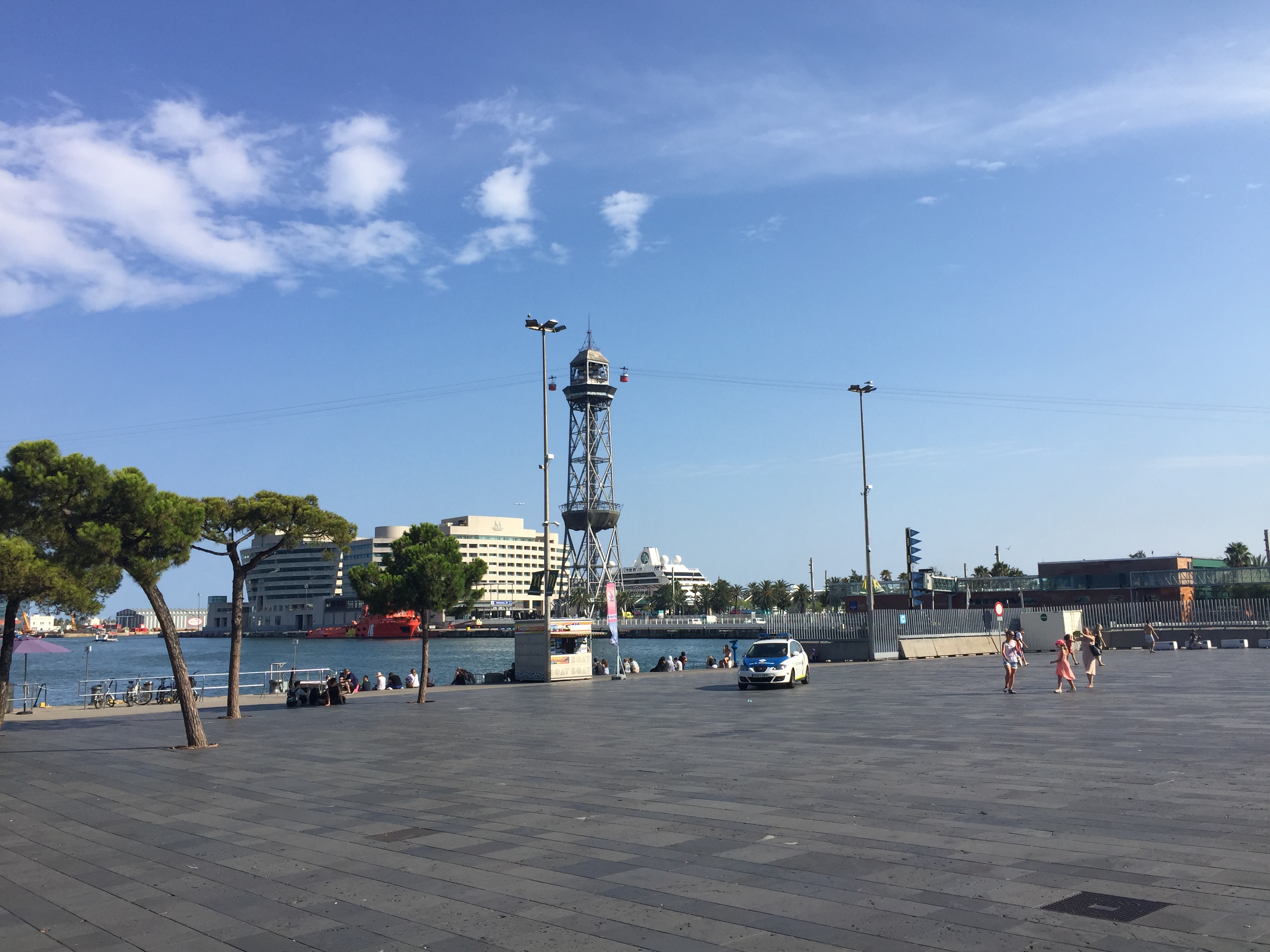 Transbordador Aeri del Port- Port Cable Car- A wide angle view of the 7 minute cable car ride that takes passengers from Montjuic to San Sebastian Beach. In addition to the spectacular view of the entire city, at the top of the San Sebastian tower is a gourmet restaurant, Torre de Alta Mar (Tower of the High Sea).