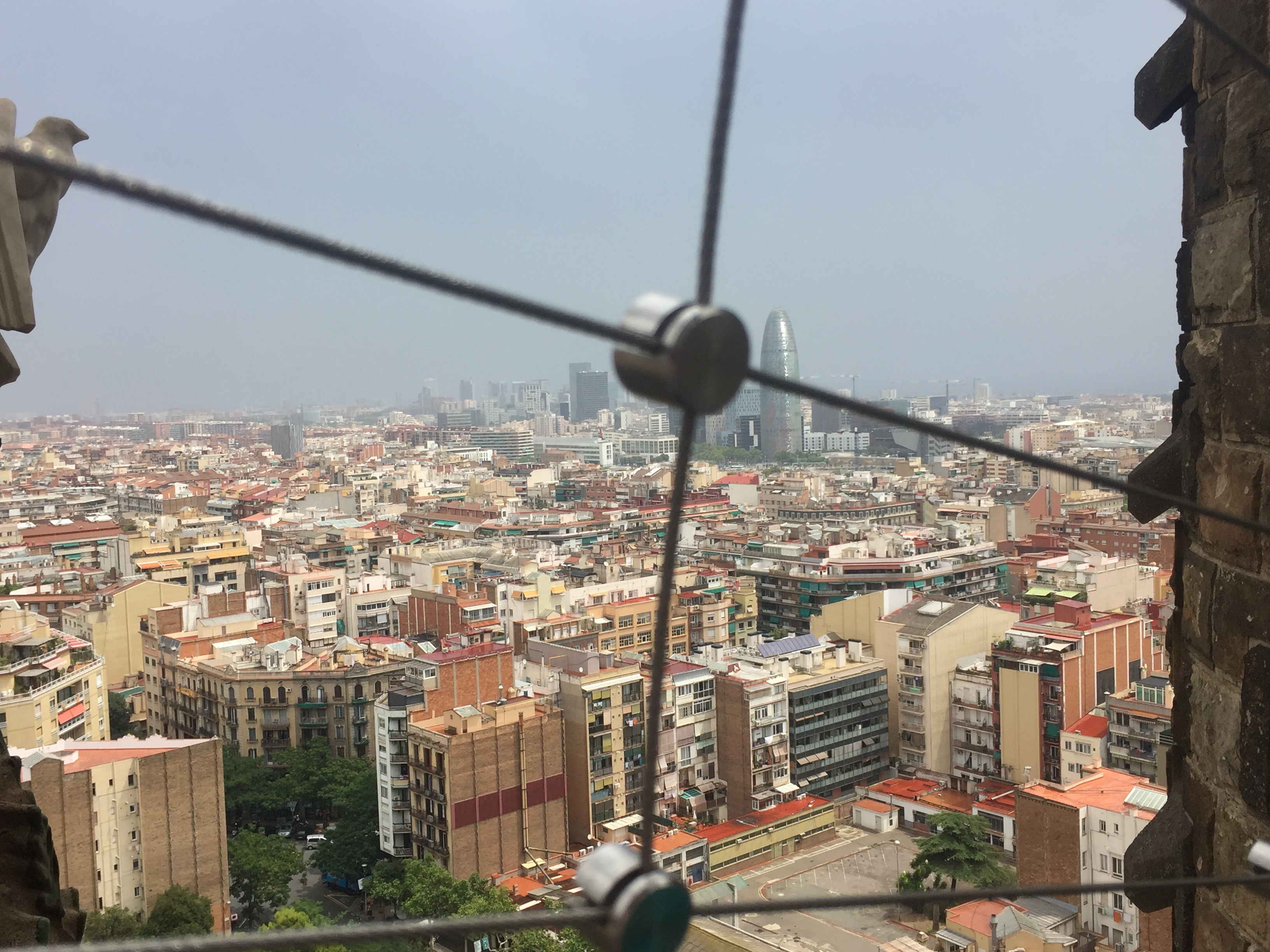 A view of Barcelona from the top of the Nativity Tower.  This view features a wider angle of the notable Torre Glóries, 