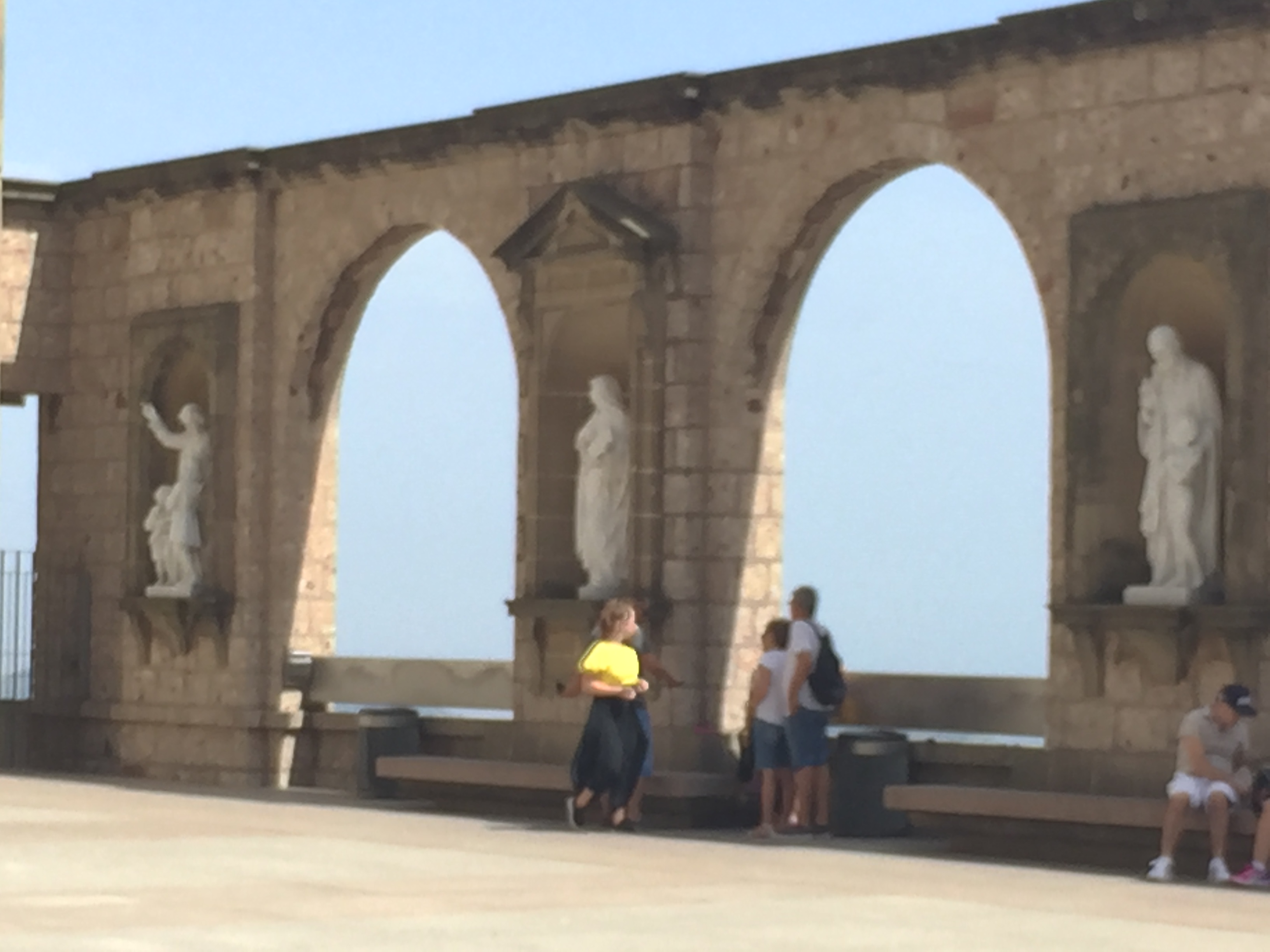 Montserrat- A closeup of 3  statues located in the plaza adjacent to the Basilica.
