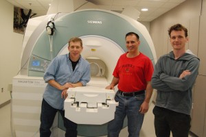 Greg Berns, Mark Spivak, and Peter Cook by the MRI