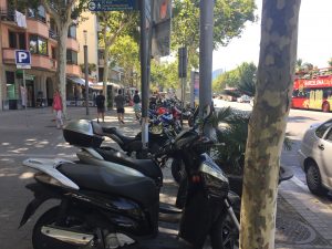 Scooters on Passeig de Joan de Borbó- Scooters were almost as common as automobiles. Scooter parking was usually on the sidewalk. And regarding color, you can have any color you want, as long as it is black.