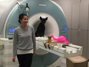 Sairina and Ninja posing at the scanner after completing the Tiki Learning experiment.