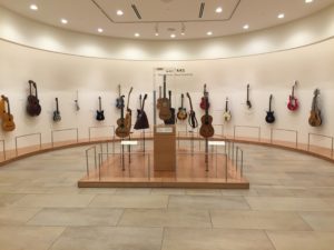 Phoenix, Arizona- Have you ever seen this many guitars? An introductory exhibit at the Musical Instrument Museum displaying the progression of guitar design from acoustic to electric.