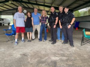 (l - r) Mark Spivak, Jenny Holland, Mark Leamer, Reghan Fraley, K9 Officer Brandon DeCosse, John Bobo, and K9 Officer Will Treadwell.