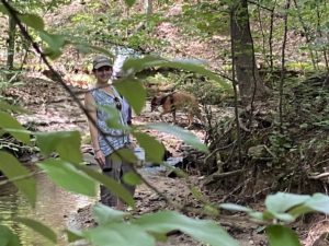 Jenny Holland observing Alex Collier's dog Angie trailing the "lost" volunteer. Deep vegetation and streams were never an obstacle.